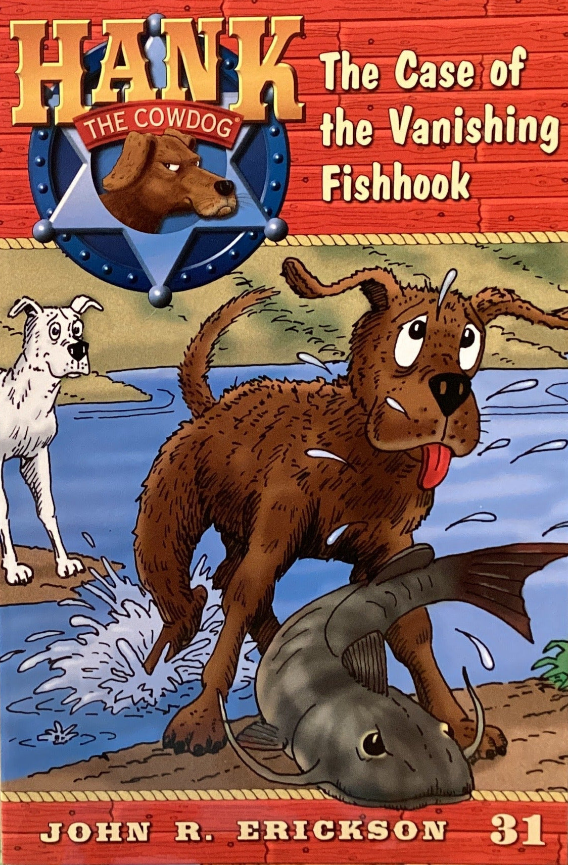 Book titled 'Hank the Cowdog: The Case of the Vanishing Fishhook' by John R. Erickson on a gray surface.