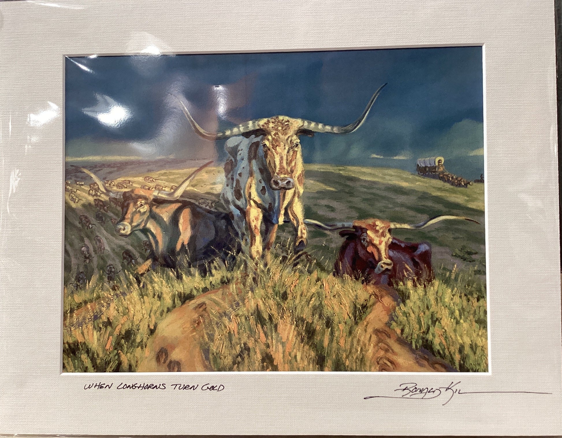 Framed painting of longhorn cattle in a field with a horse-drawn cart.