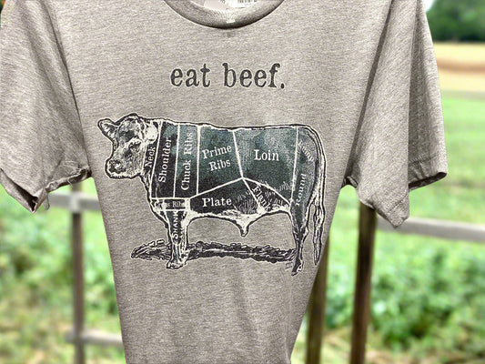 Gray t-shirt with beef cuts diagram and 'eat beef.' text on a plain background