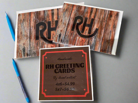 Two greeting cards with a rustic wood design and 'RH' branding, along with a card displaying 'RH Greeting Cards' text.