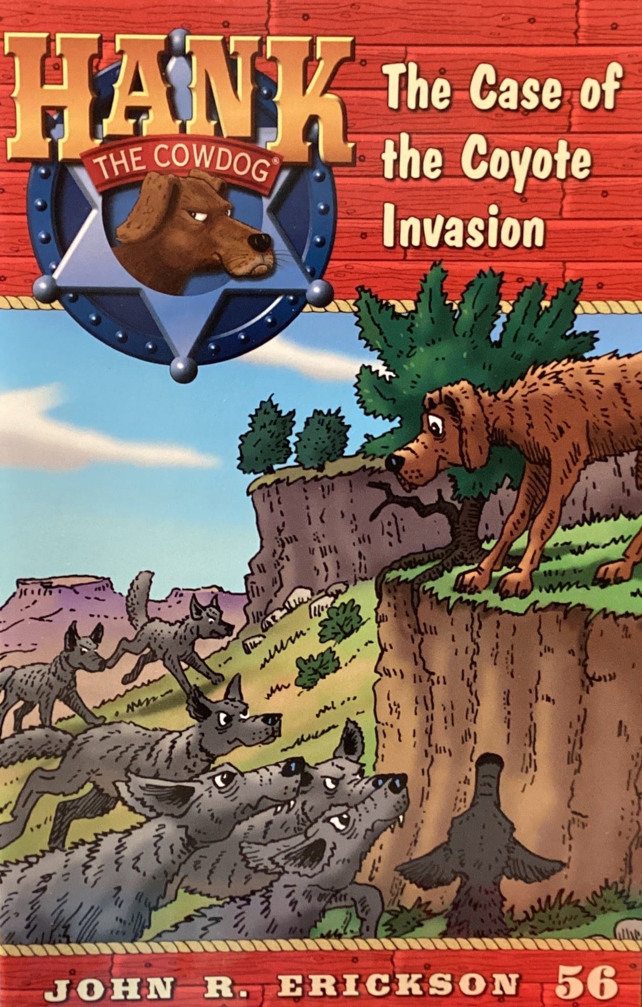 Book titled 'Hank the Cowdog: The Case of the Coyote Invasion' by John R. Erickson on a surface.