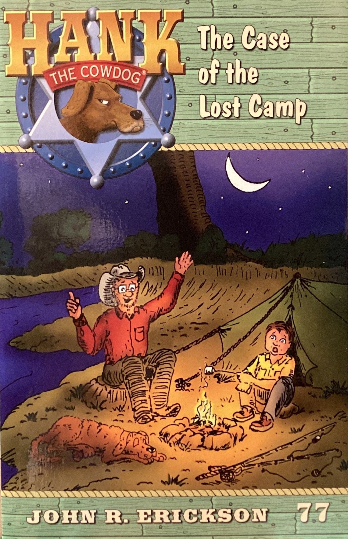 Book titled 'Hank the Cowdog: The Case of the Lost Camp' by John R. Erickson on a shelf.