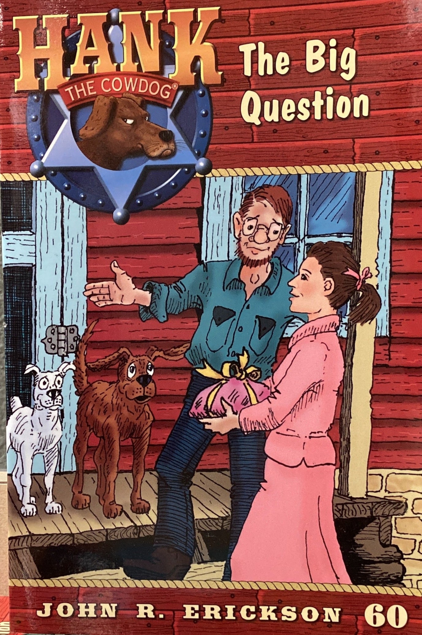 Book titled 'Hank the Cowdog: The Big Question' by John R. Erickson on a surface.