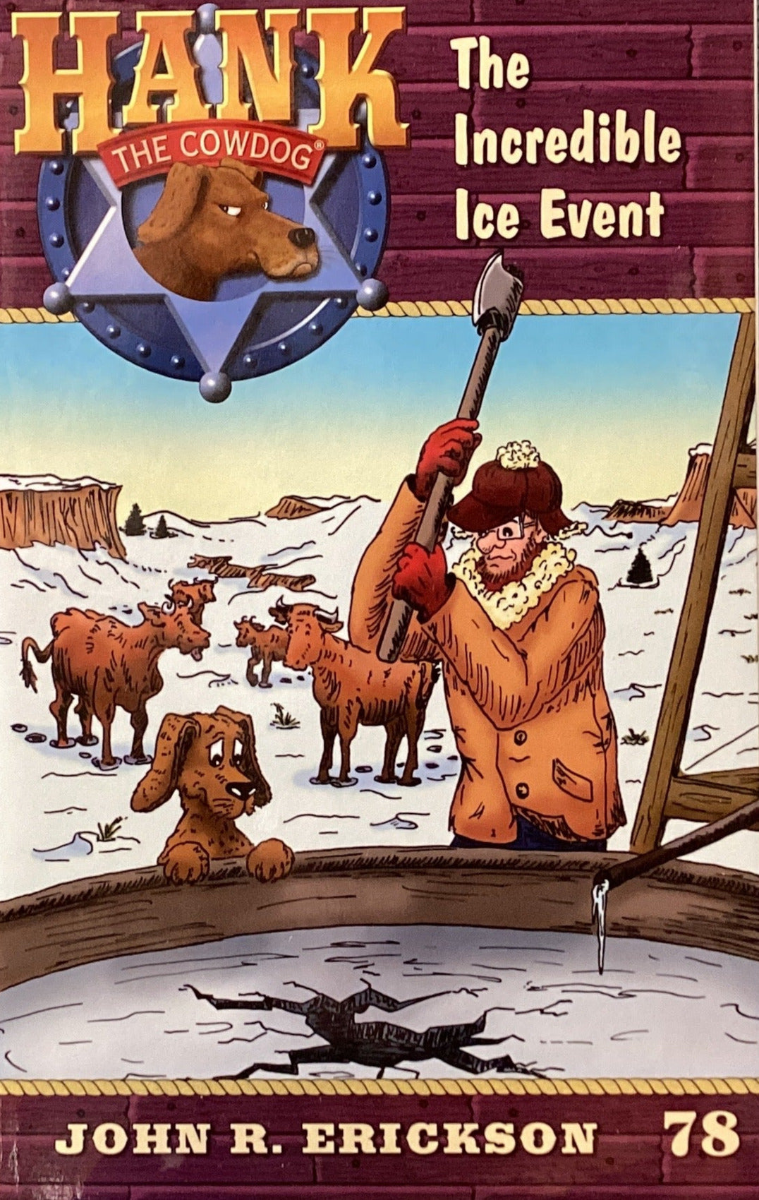 Book titled 'Hank the Cowdog: The Incredible Ice Event' by John R. Erickson on a table against a gray wall.