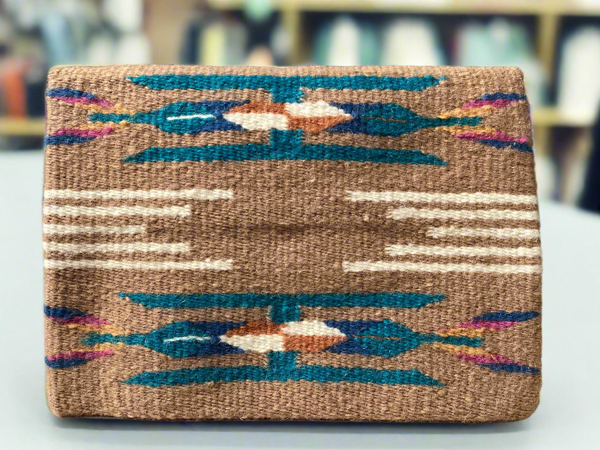 Woven mat with geometric pattern on a plain background