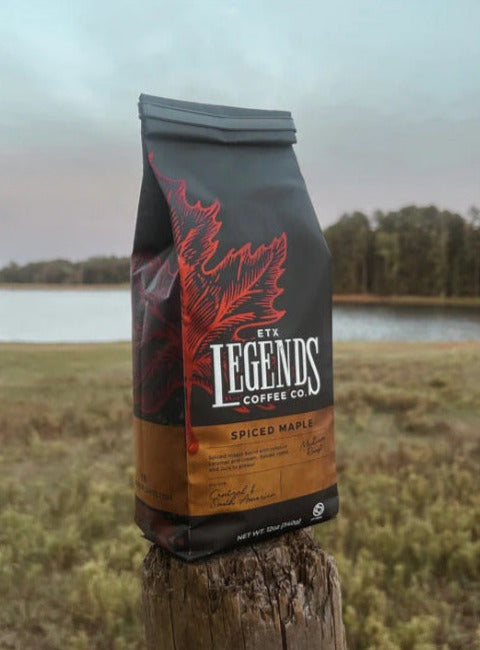 Legends Coffee bag on a wooden post with a scenic background