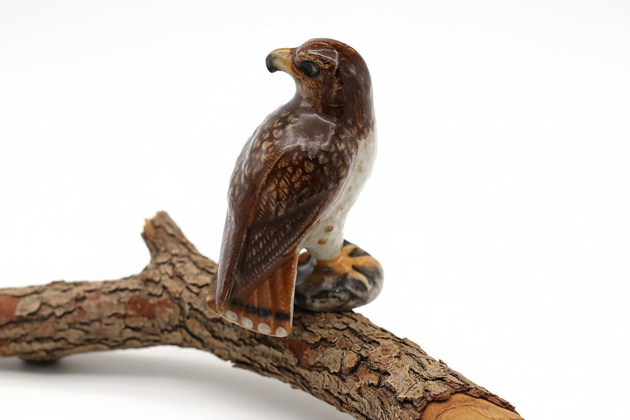  ceramic falcon figurine on a white background
