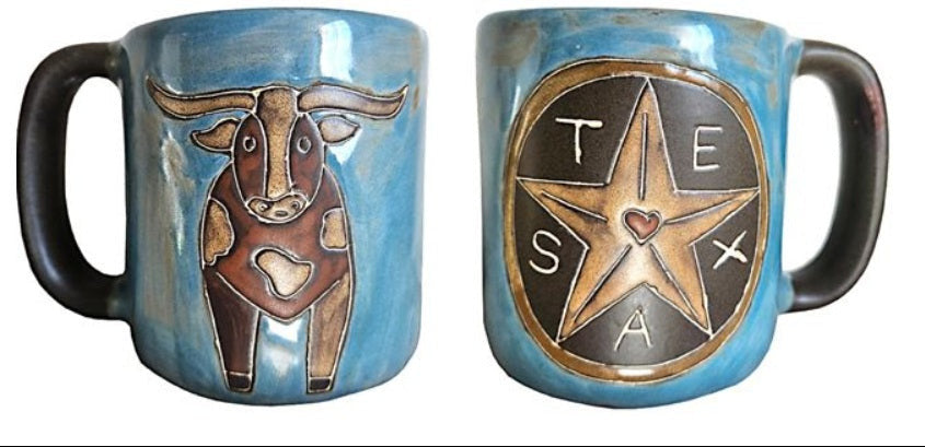 Two blue ceramic mugs with a longhorn cow and Texas star design on a white background.