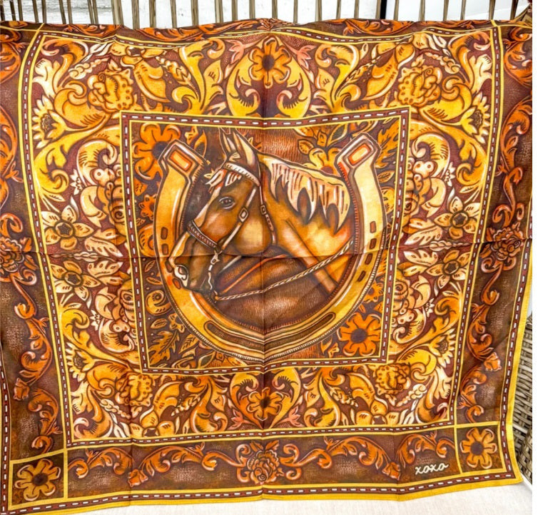 Decorative scarf with horse emblem and intricate patterns on a white background